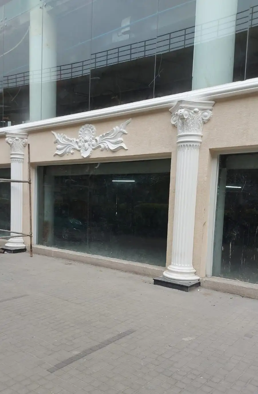 1 MG-Lido Mall, MG Road, Bengaluru: A shopfront bay with a column and an ornament under the cornice band