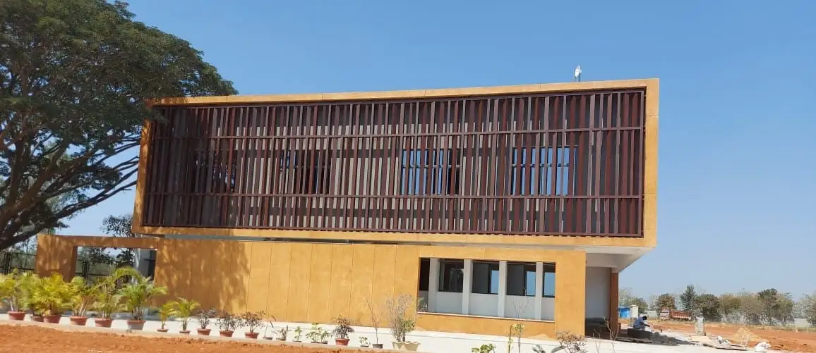 Basil Woods International School, Gunjur, Bengaluru: Vertical fins wrapping the upper floor, held in a deep frame