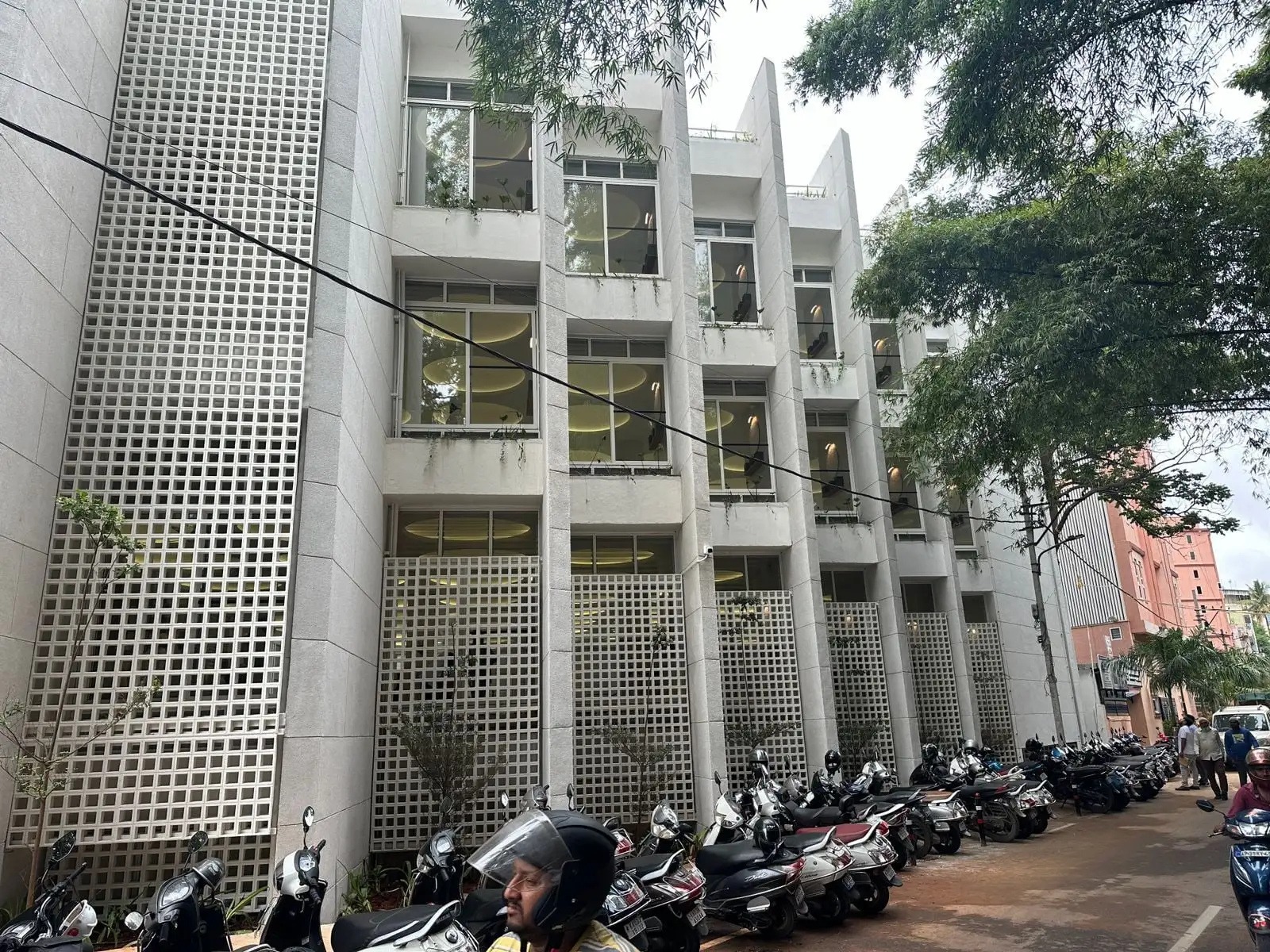 Bismilla Green Masjid: Square-grid jaali screens in front of each bay along the length of the building