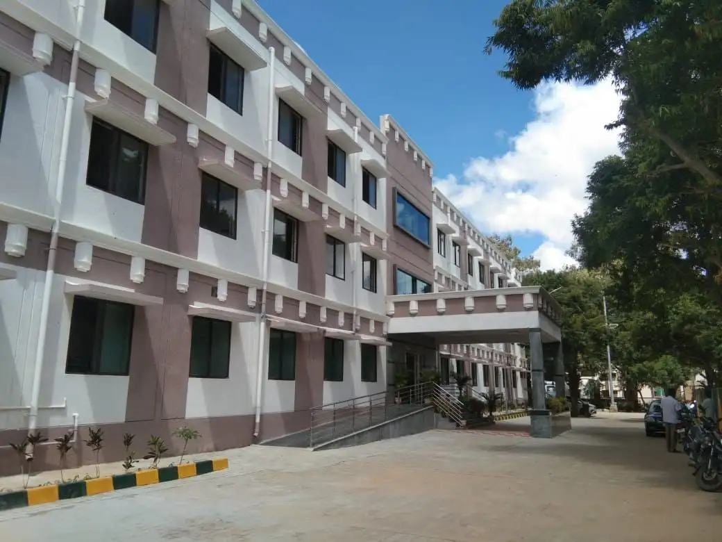 CMH Hospital, Kolar, Karnataka: Window hoods on rows of small brackets along every floor