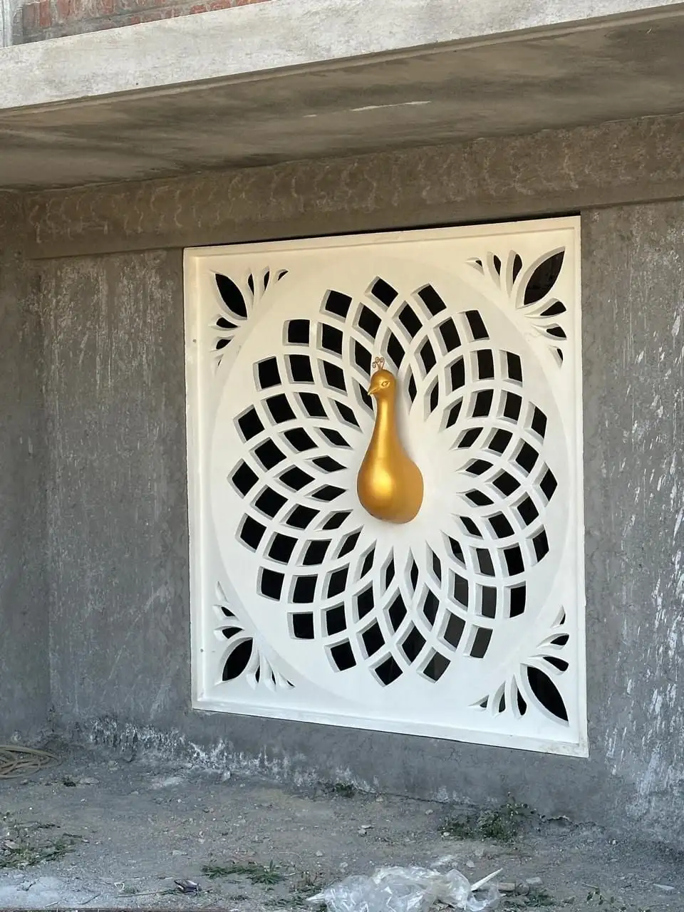 ISKCON Coimbatore, Coimbatore, Tamil Nadu: A square jaali panel with a petal lattice and a gold peacock at the centre