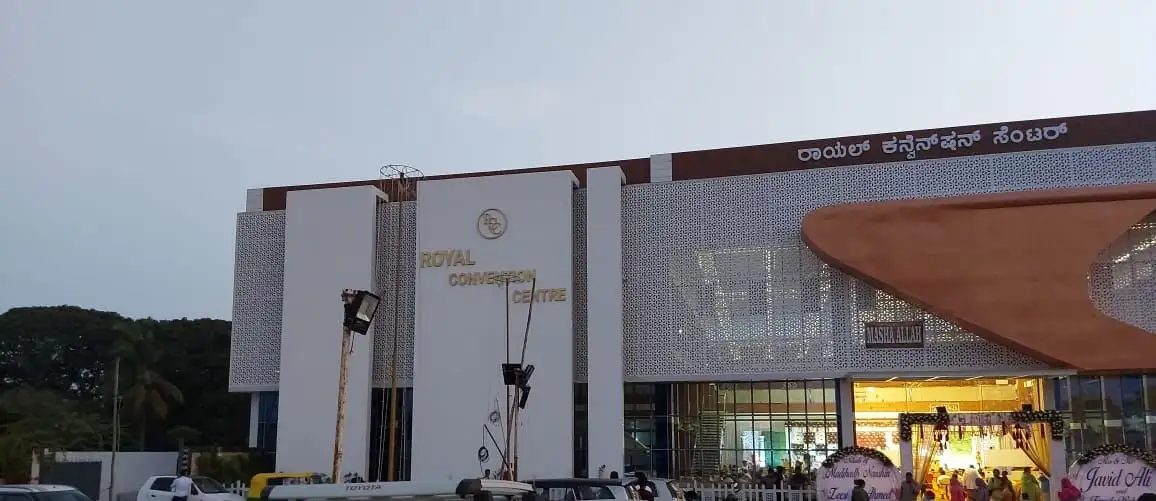 Royal Convention Centre, Mysuru, Karnataka: The convention centre front: jaali panels across the upper facade, and the curved canopy over the entrance
