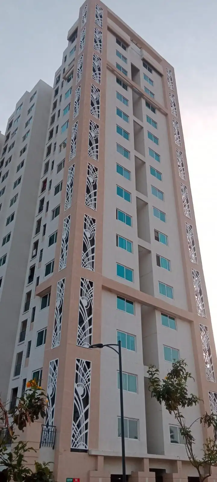 Shriram Greenfield, Bidarahalli, Bengaluru: Leaf-pattern screens running up the tower beside each column of windows