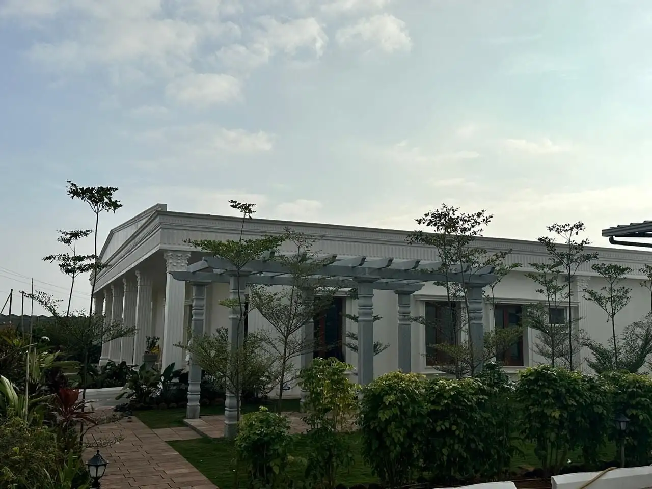 TDP office: Columns, window surrounds and a pergola beside the garden